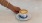 a hand holding a cup of coffee