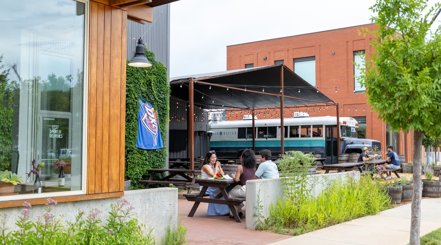 Outdoor food truck with seating and people