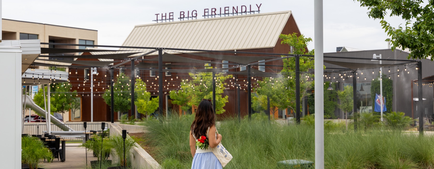 a person walking with flowers 