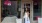 a person standing in front of a storefront